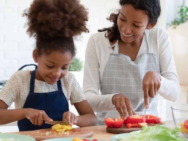 Mother and daughter cooking
