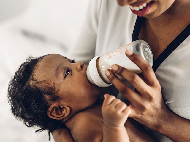 A baby drinking from a bottle